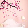 ceiling tree branch with falling blossoms